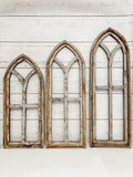 Three wall arches in successive sizes, small, medium and large.