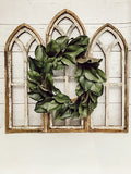 Rustic Cathedral Wall Arches, two medium and one large with a 17 inch magnolia wreath in the middle.