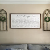 Two medium cathedral wall arches with small boxwood wreaths on either side of a large farmhouse sign.