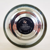 Bottom view of the chrome vessel candle. Fragrance White Christmas. 