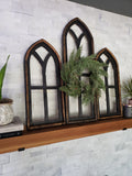 Black Cathedral Windows on a Mantel with wreath