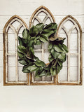 Rustic Cathedral Wall Arches, two medium and one large with a 17 inch magnolia wreath in the middle. 